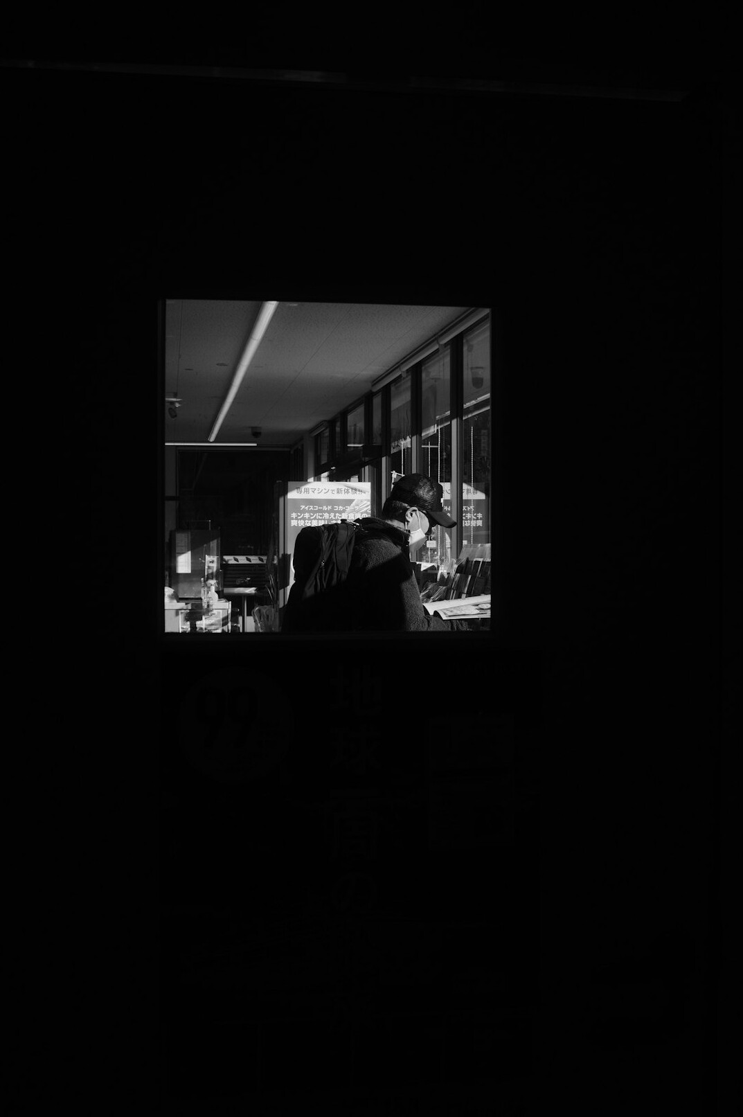 Rows of broadcast monitors in a dark television director's gallery