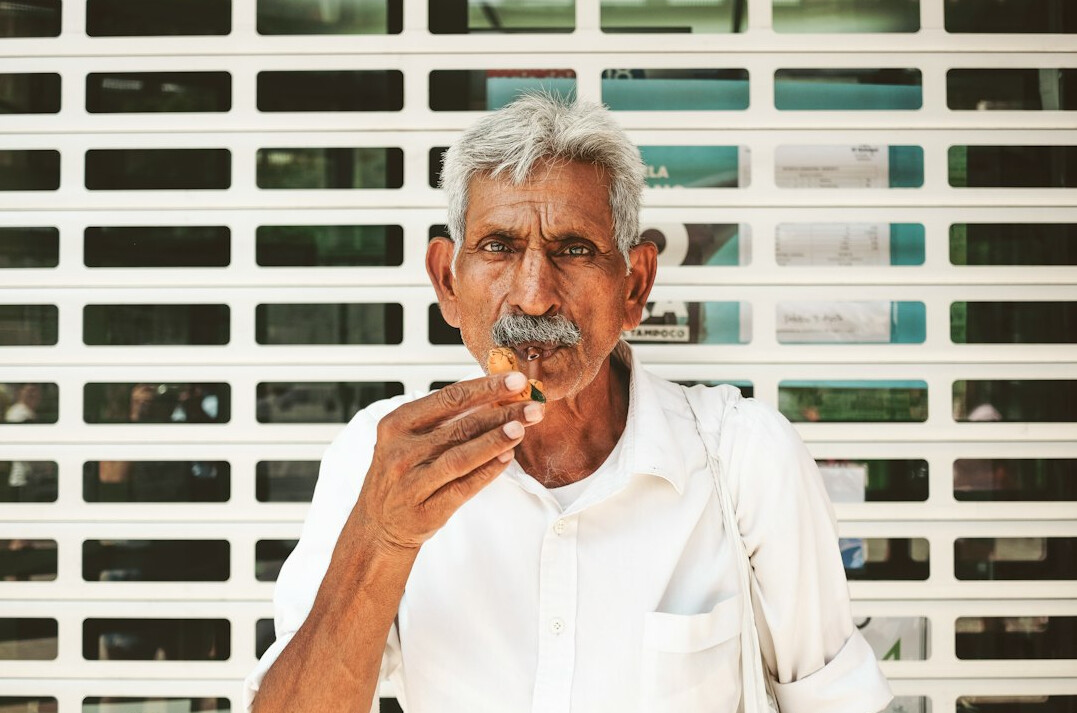 Portrait of a mature man in his fifties with grey hair and a calm expression