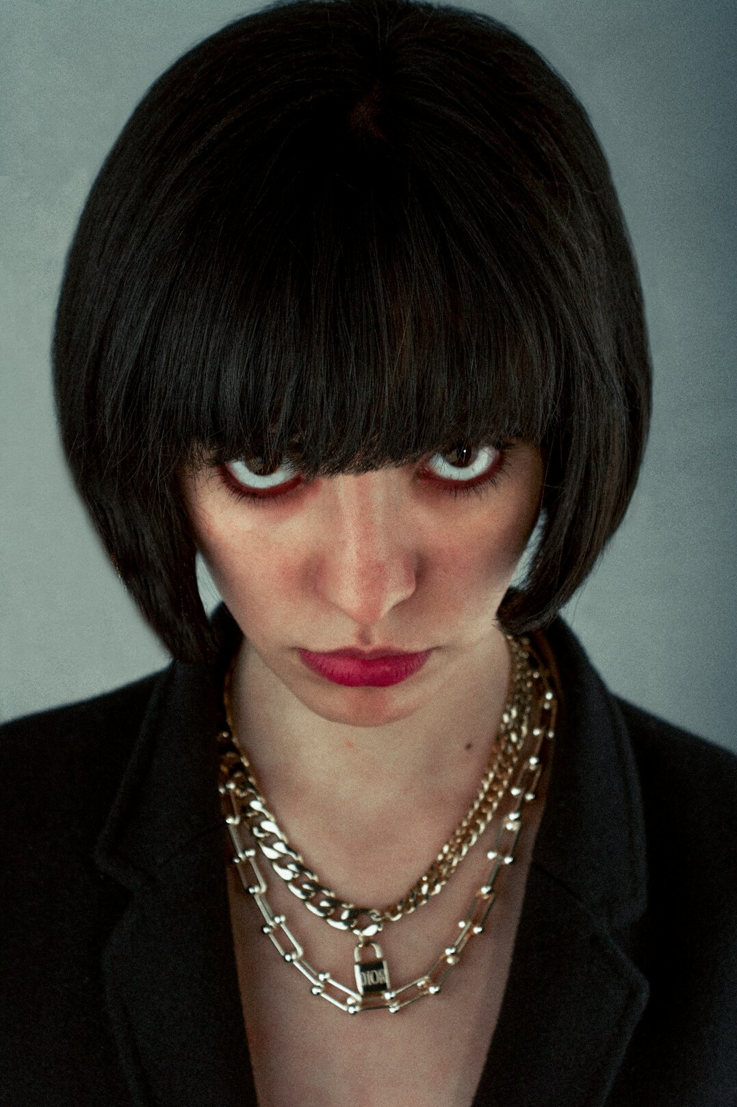 Portrait of a woman in her late forties with a dark bob haircut