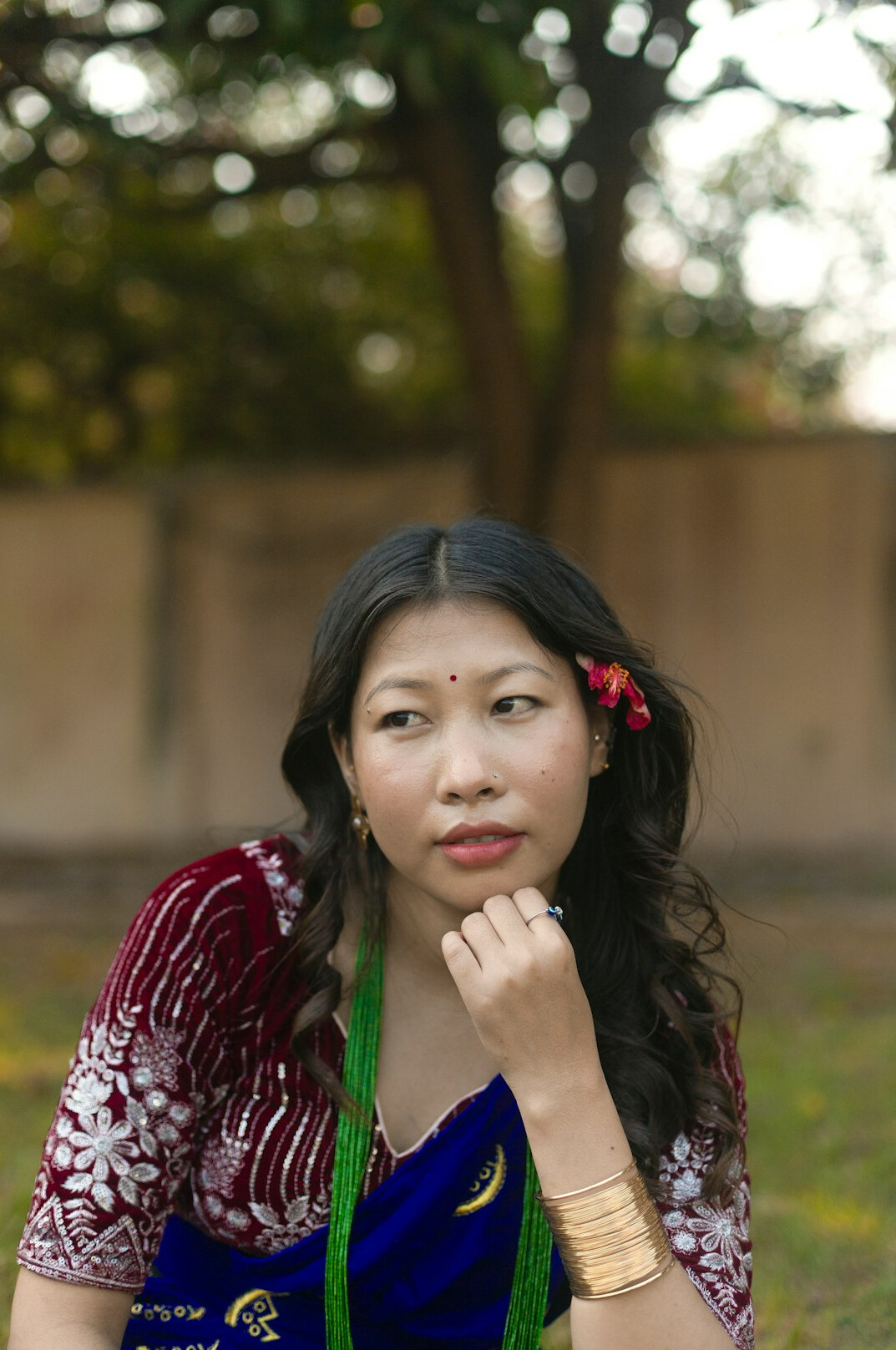 Portrait of a South Asian woman in her early thirties with long dark hair