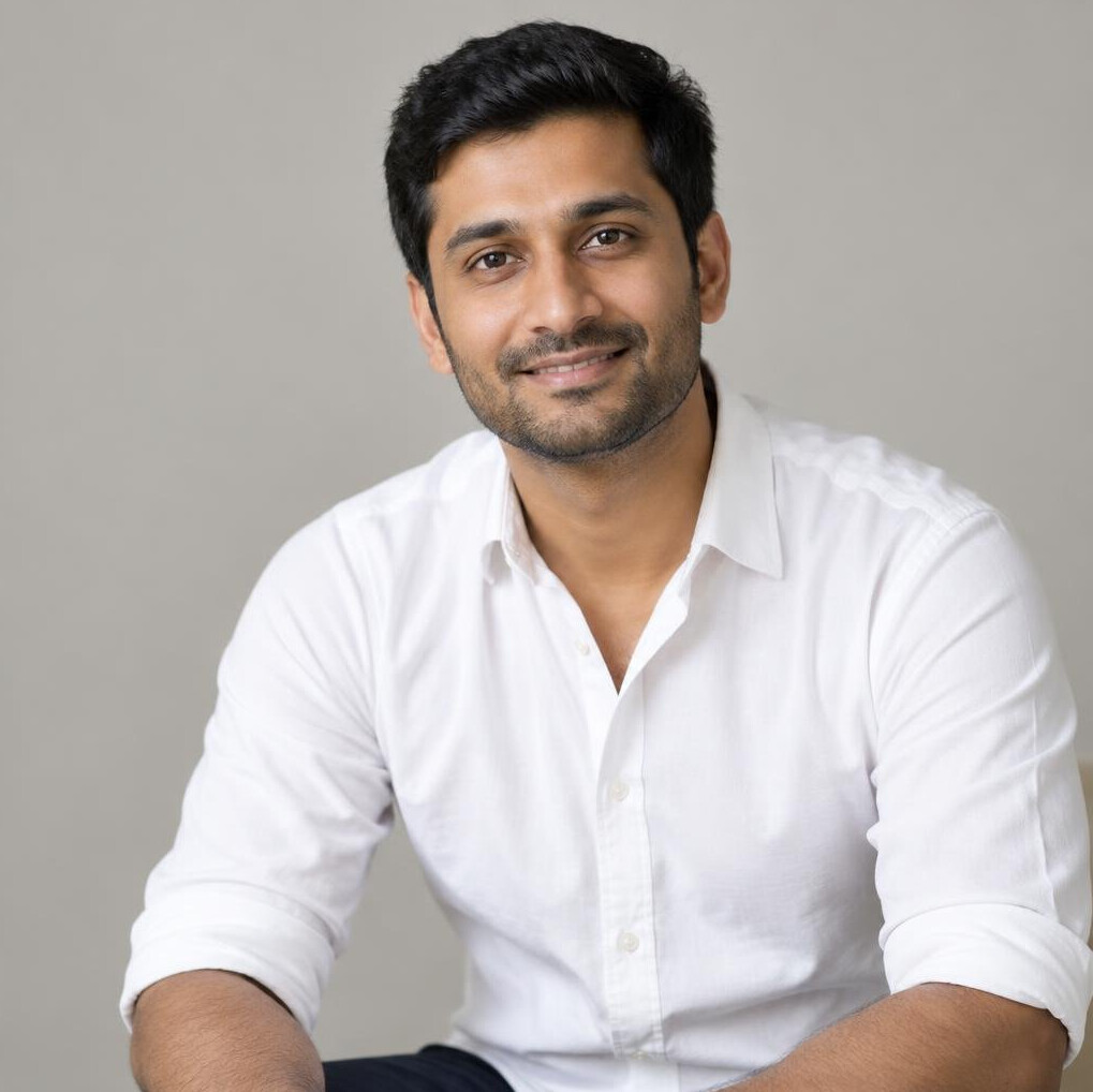 Portrait of an Indian man in his thirties with short black hair