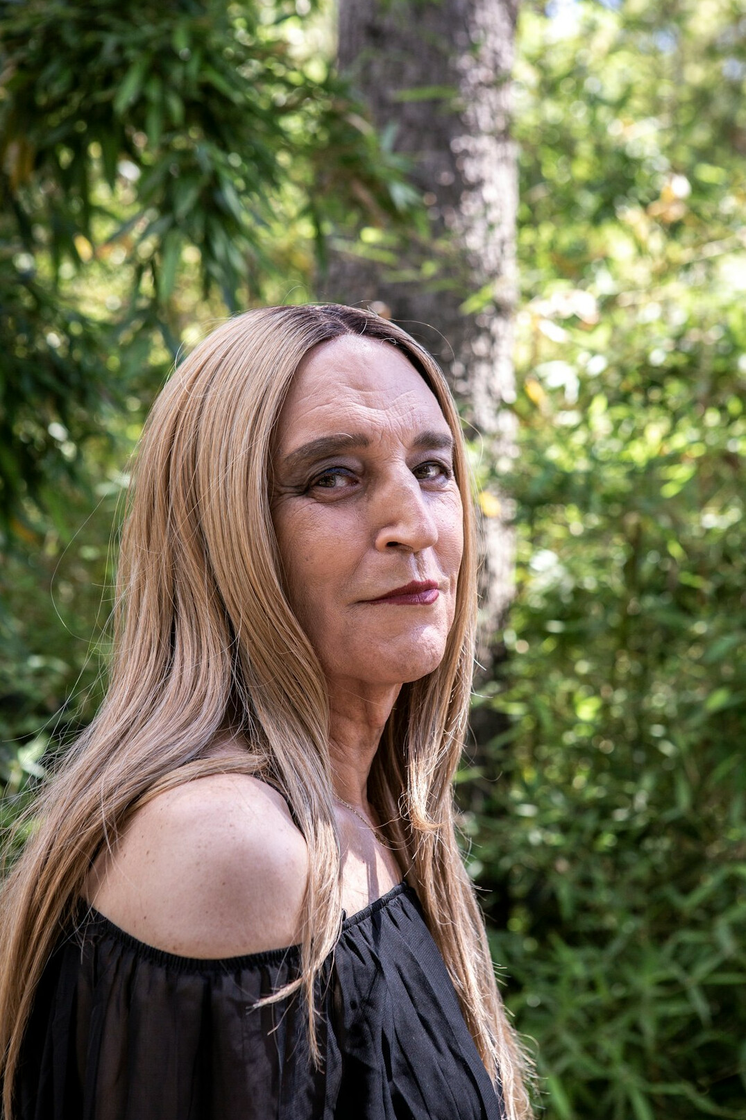 Portrait of a woman in her forties with shoulder length blonde hair